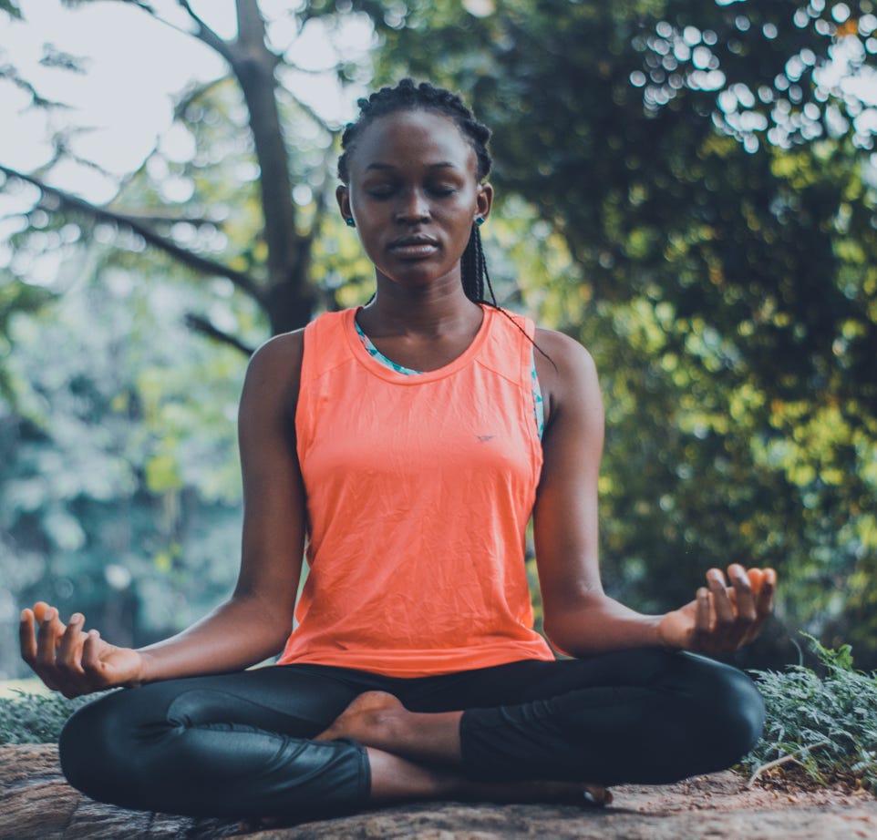 Woman Meditating in the Outdoors